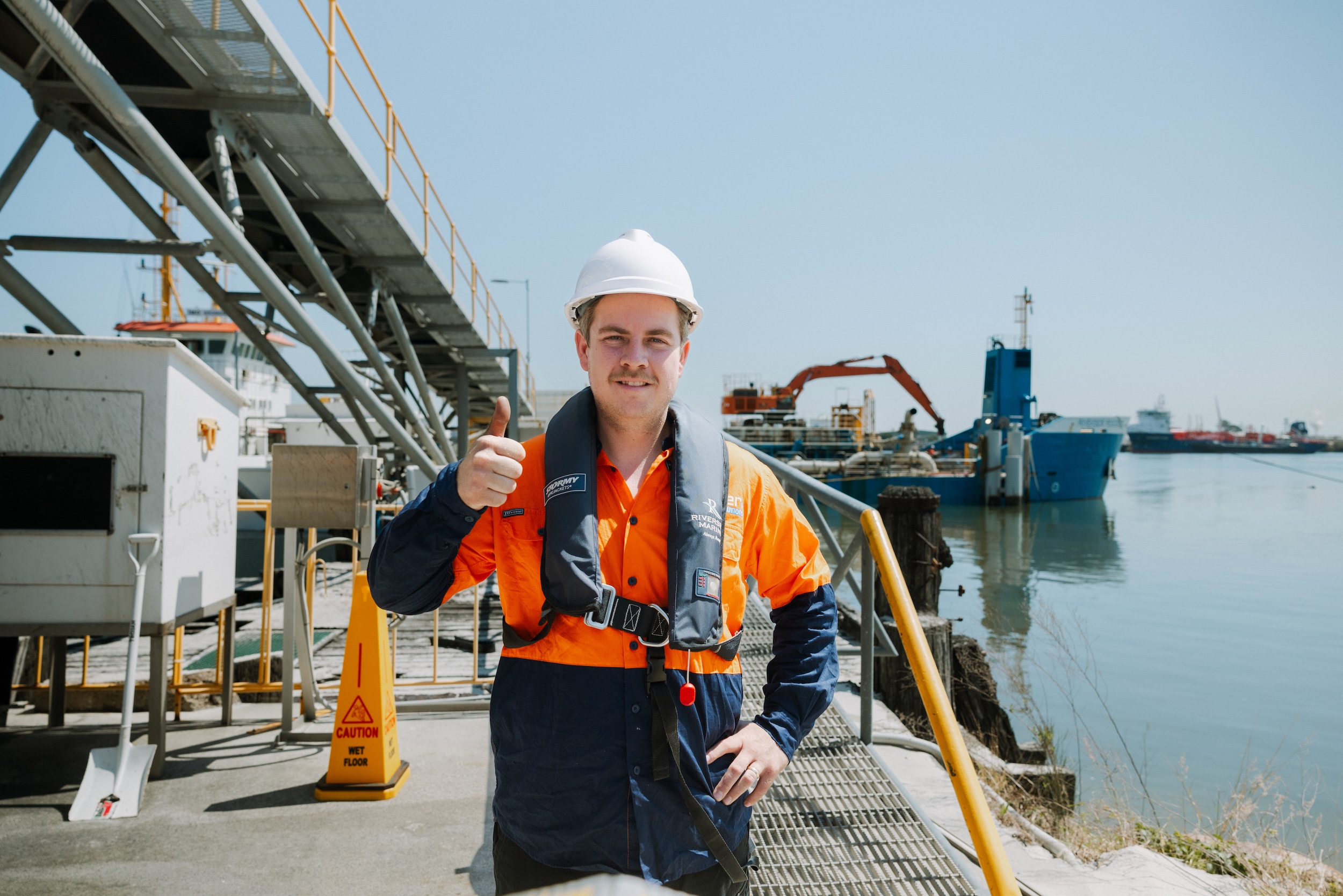 Parker Air marine technician giving thumbs up at wharf