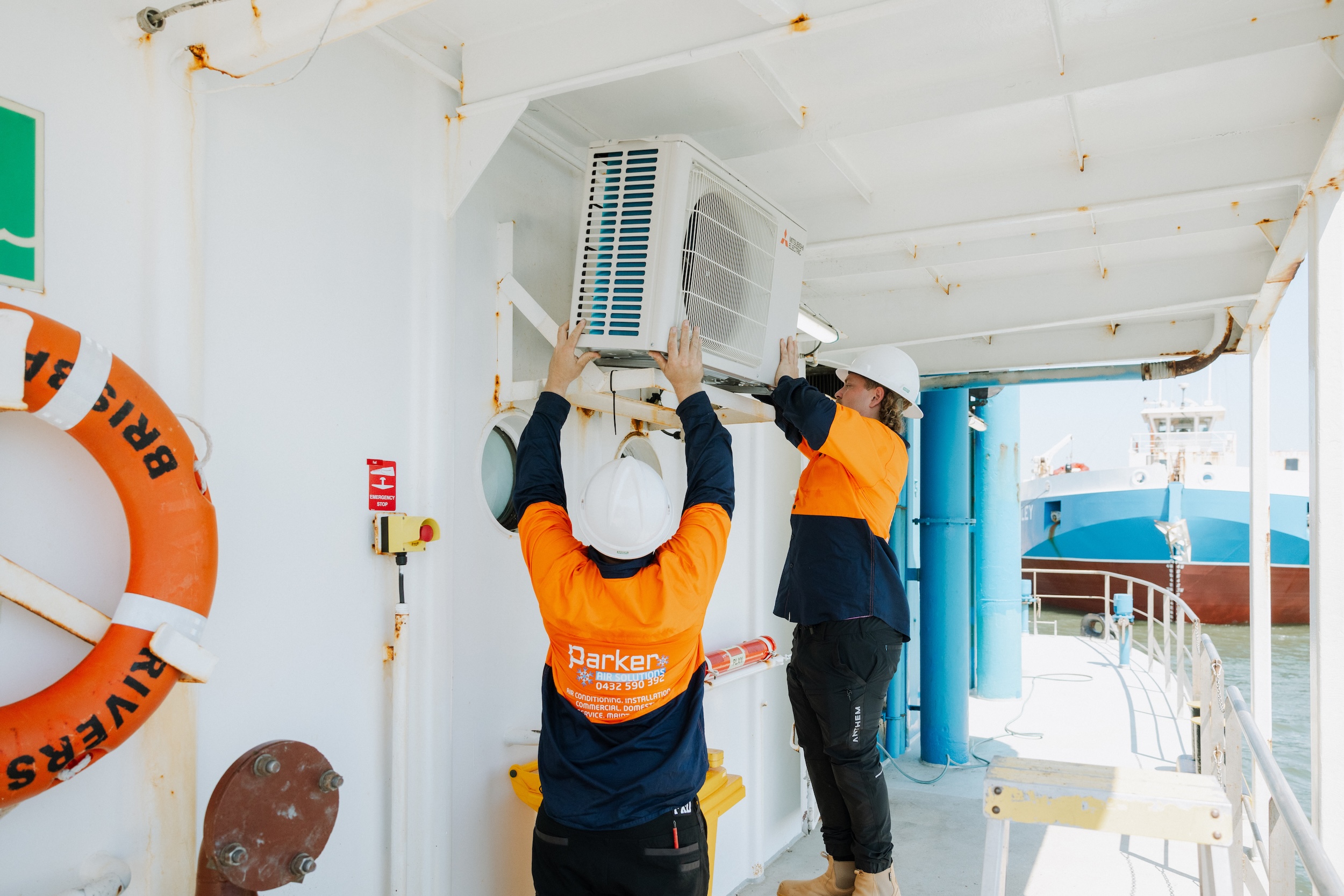 Two-person marine AC unit installation with safety lift