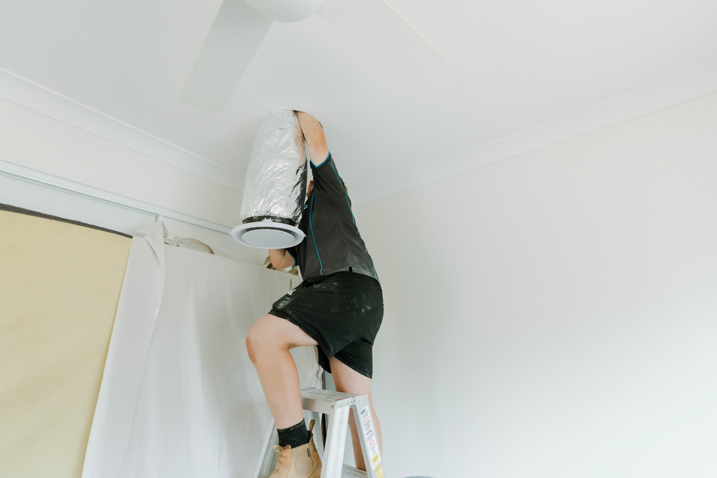 Connecting flexible ductwork to ceiling plenum box for ducted air conditioning