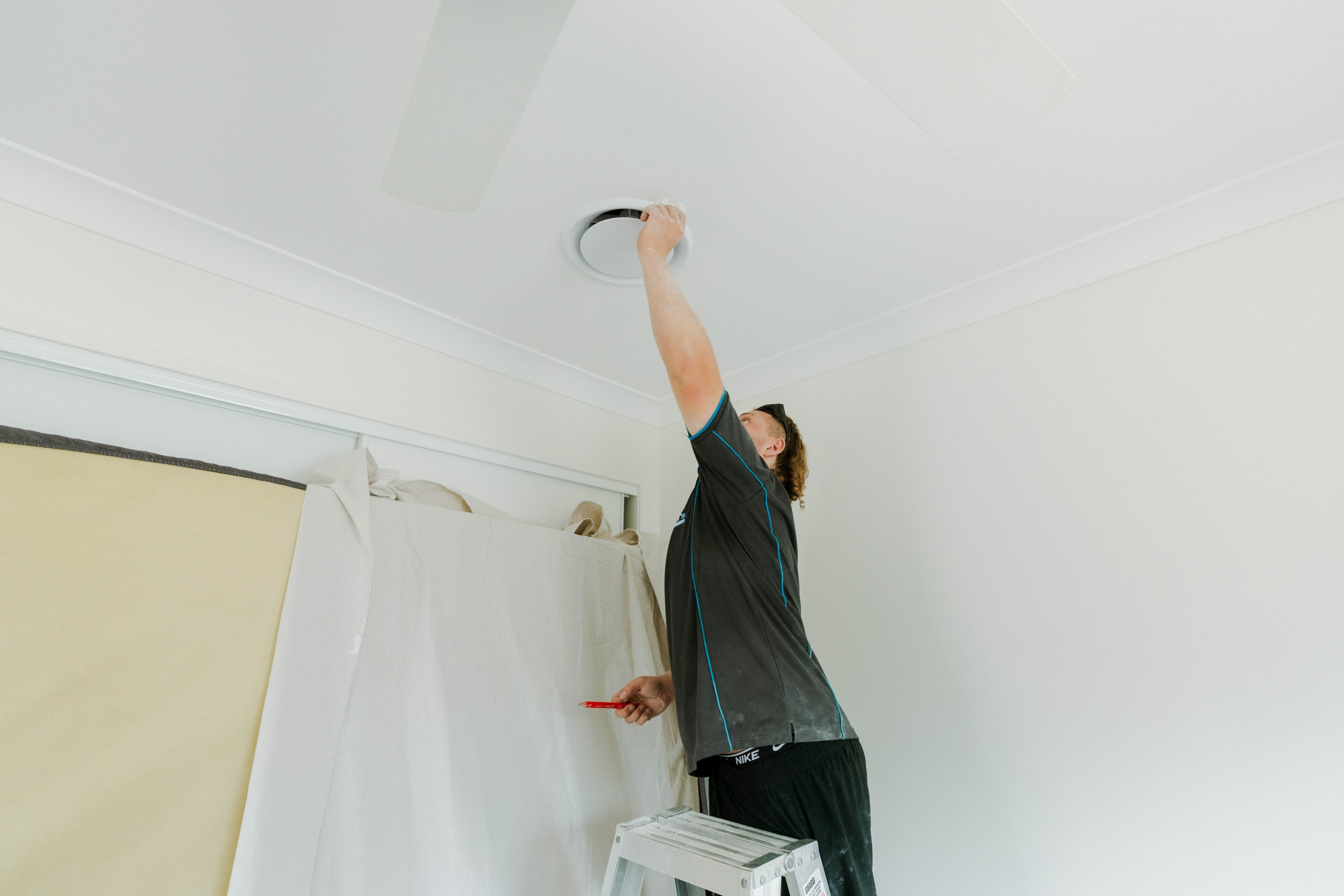 Fitting a ceiling vent diffuser to complete ducted air conditioning installation