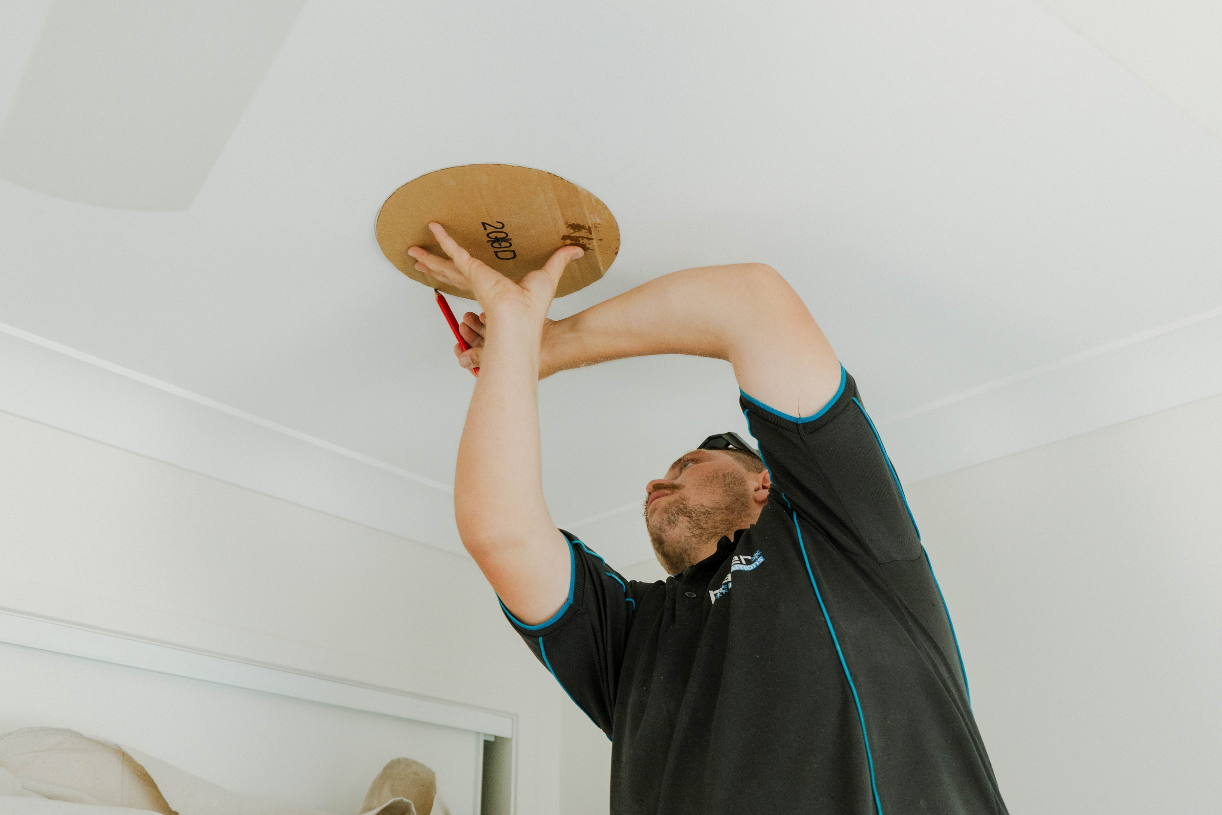 Measuring and marking ceiling cutout for a ducted air conditioning supply vent