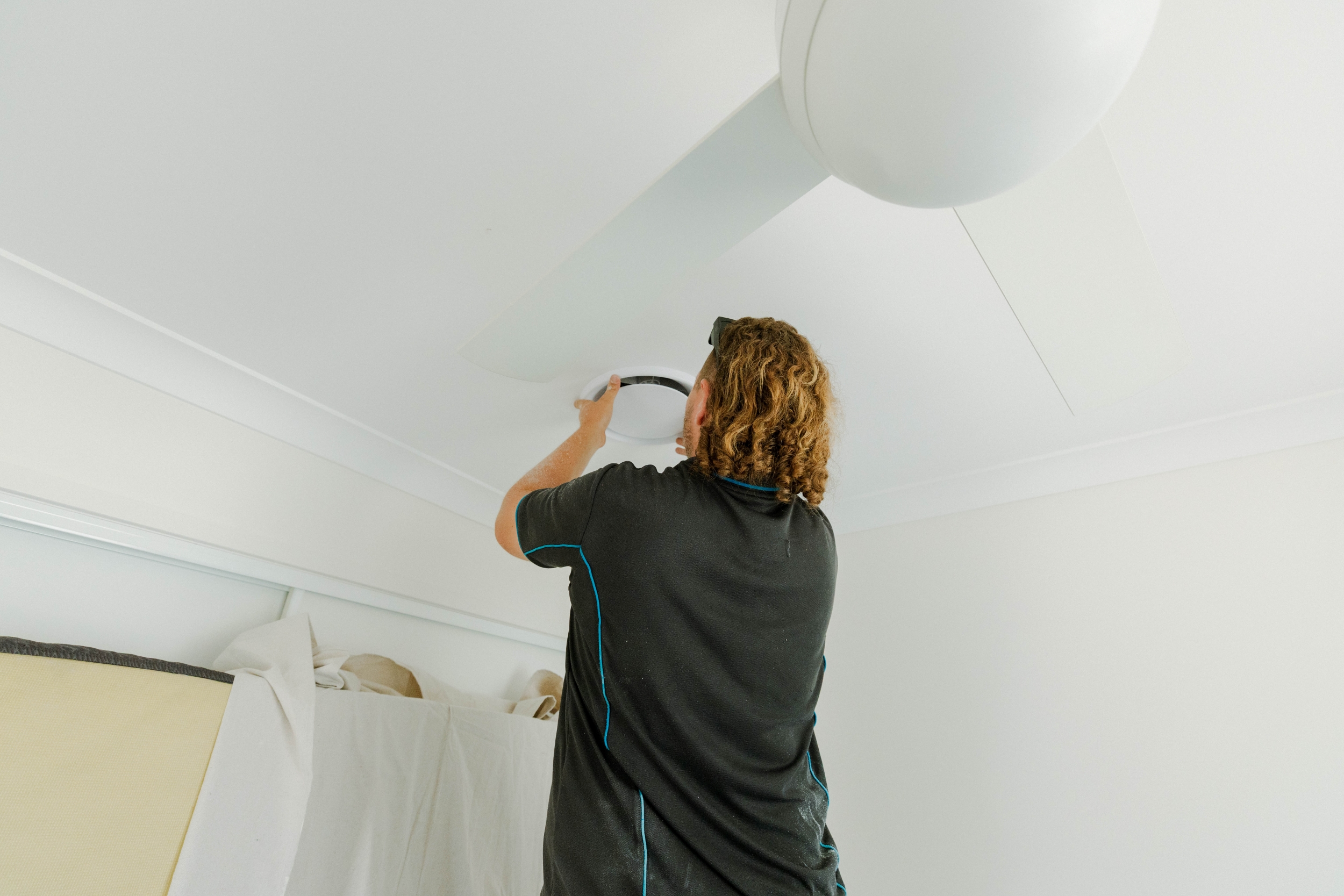 Securing ductwork connection to ceiling vent during Kallangur ducted aircon installation